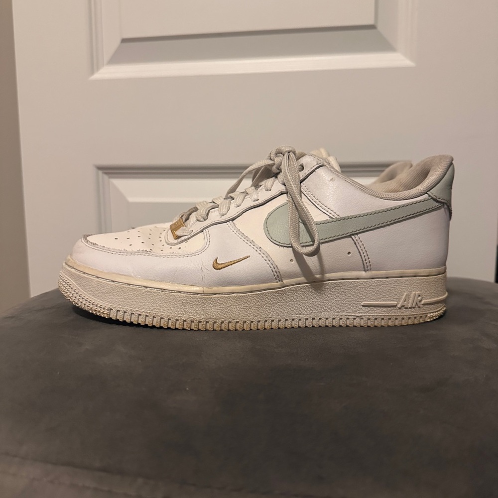 Women’s White Nike Air Force 1 with Gold and Green Accents